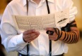 Ben Kieda performs the Mitzvah of donning Tefillin, in honor of the bride and groom, at the traditional Chabad Lubavitch Jewish wedding of Chaya Zippel and Rabbi Mendy Cohen at the Grand America Hotel in Salt Lake City on Monday, Sept. 12, 2016.