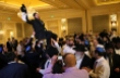 Male wedding guests lift the groom, Rabbi Mendy Cohen, up on a chair during a traditional Chabad Lubavitch Jewish wedding at the Grand America Hotel in Salt Lake City on Monday, Sept. 12, 2016. Men and women celebrate separately.